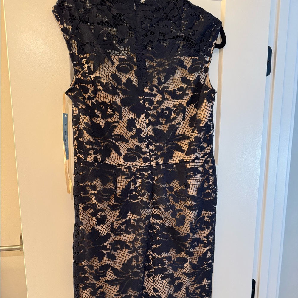 Women’s navy blue cocktail dress with nude underlay, beautiful lace neckline.